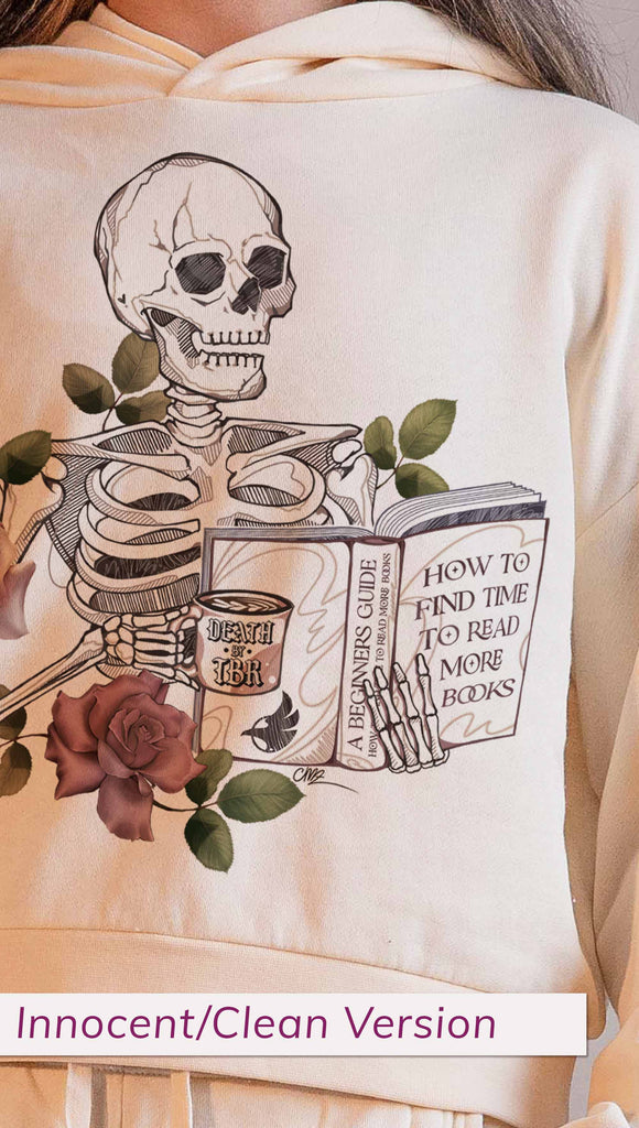 Model wearing WERKSHOP  "Death by TBR" Hoodie in Bone Colorway ~ Innocent/Clean version with the phrase, "How to Find Time to Read More Books". Featuring a skeleton holding a book in one hand and a coffee mug in the other with accent roses.