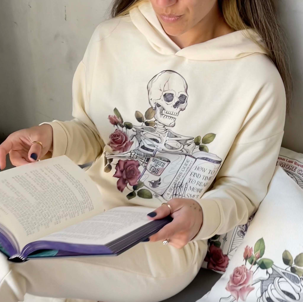 Girl casually sitting and reading a book while wearing WERKSHOP "Death by TBR" Hoodie Set