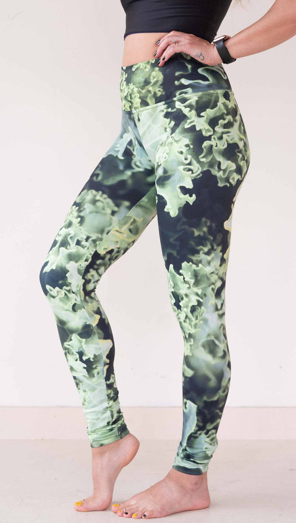 Model wearing WERKSHOP Leggings printed with a macro image of green kale.