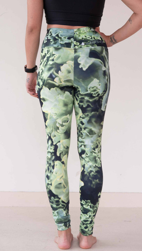 Model wearing WERKSHOP Leggings printed with a macro image of green kale.