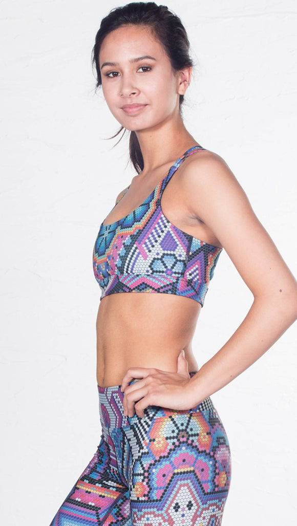 left side view of model wearing purple latin beads inspired sports bra with matching leggings