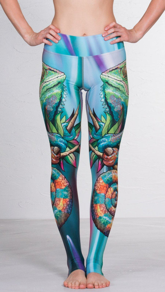 close up front view of model wearing colorful chameleon printed full length leggings