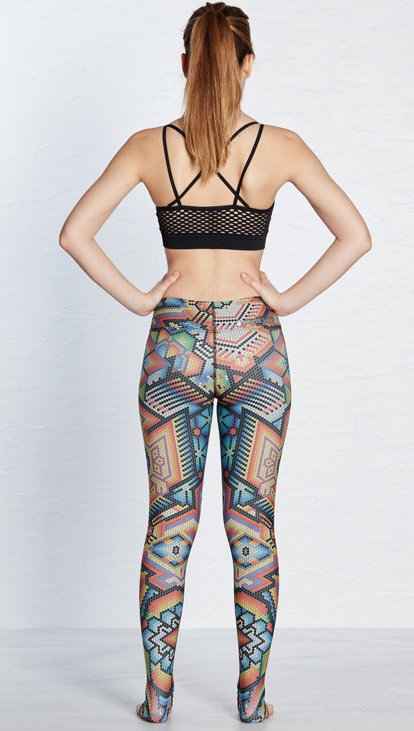 back view of model wearing beaded themed printed full length leggings with eagle motif