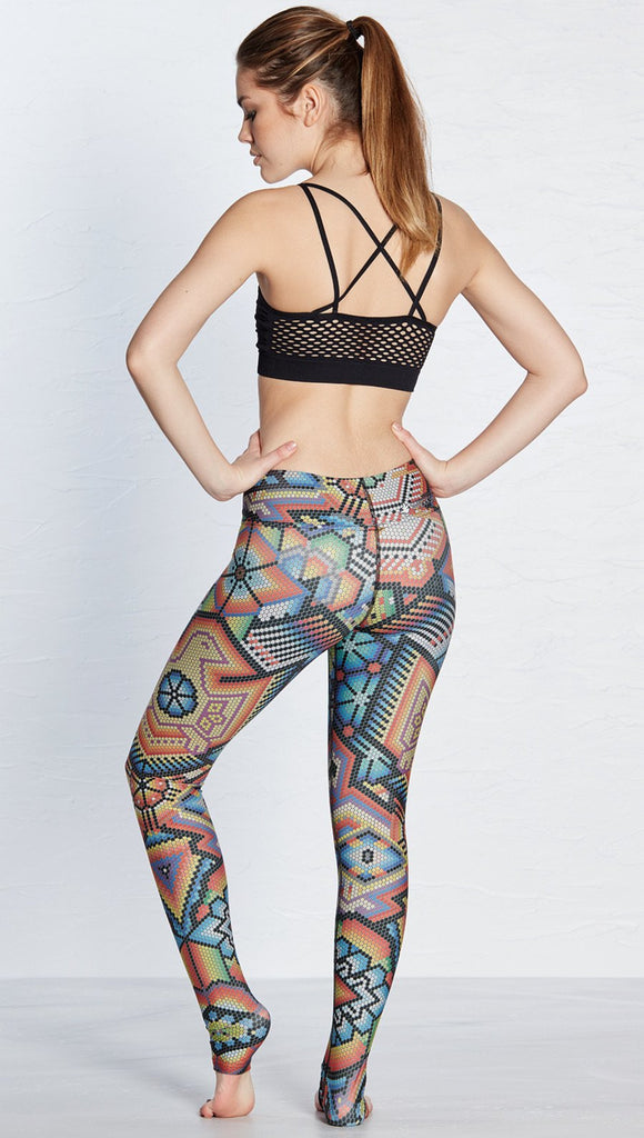 back view of model wearing beaded themed printed full length leggings with eagle motif