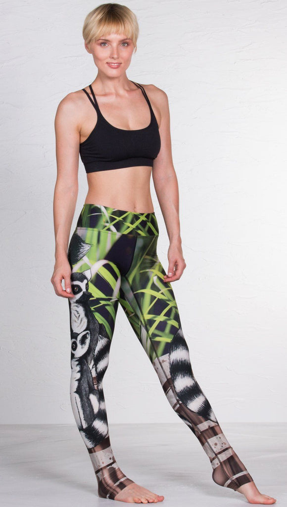 front view of model wearing lemur themed printed full length leggings