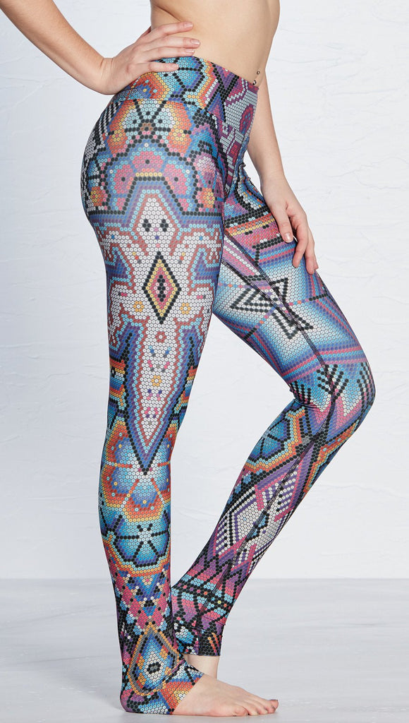 close up right side view of model wearing purple beaded lizard themed printed full length leggings