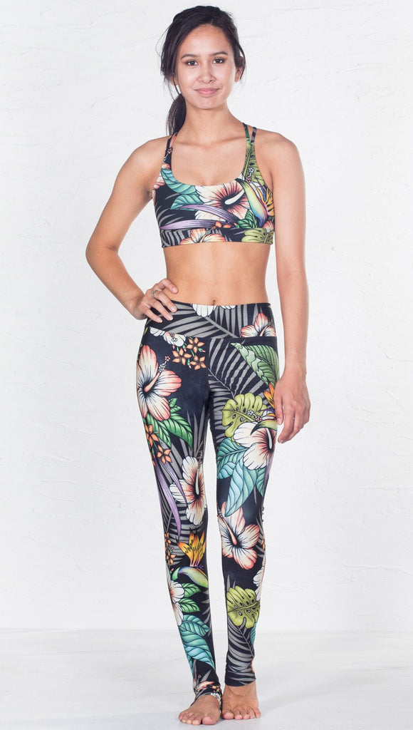 front view of model wearing tropical flower inspired printed sports bra