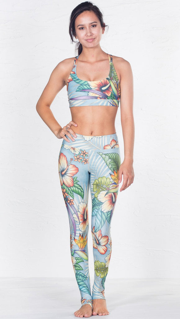 front view of model wearing tropical flower inspired printed sports bra